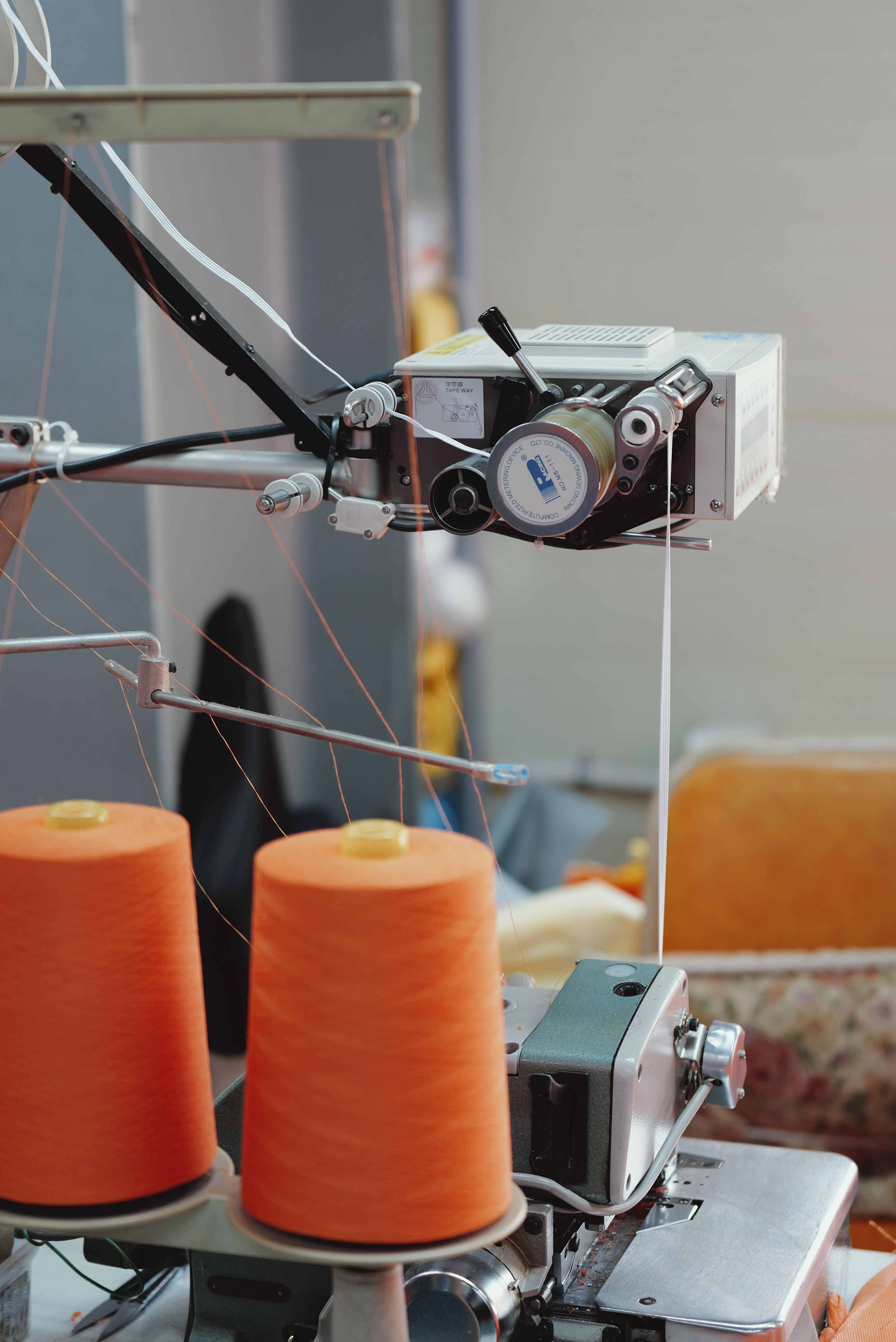 Close view of garment production machinery and material handling