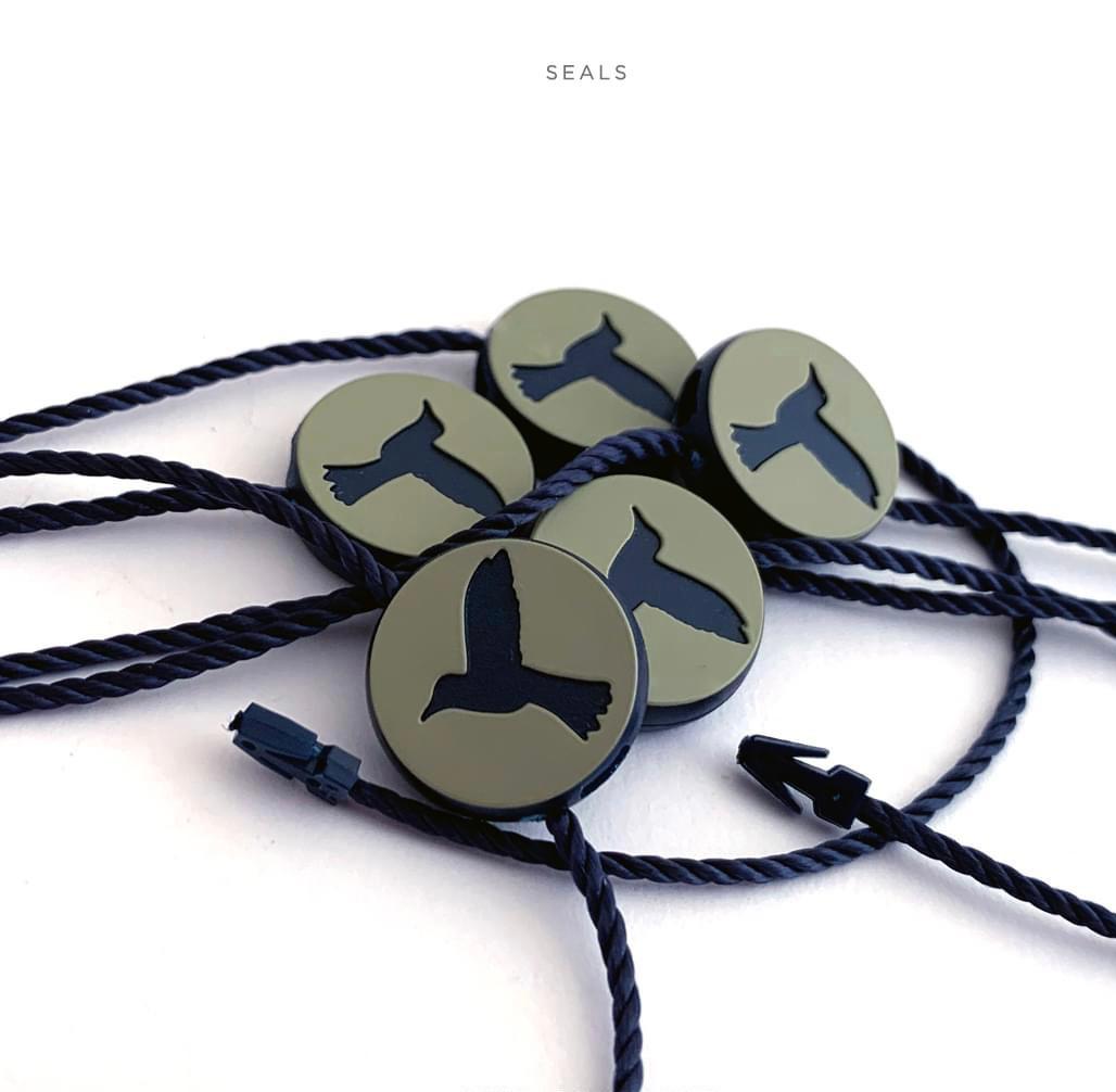 Seals badges and garment hardware